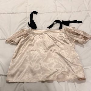 Champagne top with black bows